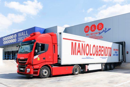 Red delivery truck mockup with Manolo Bendito branding. Ideal for showcasing logistics or transportation graphics. Clear background for design templates.