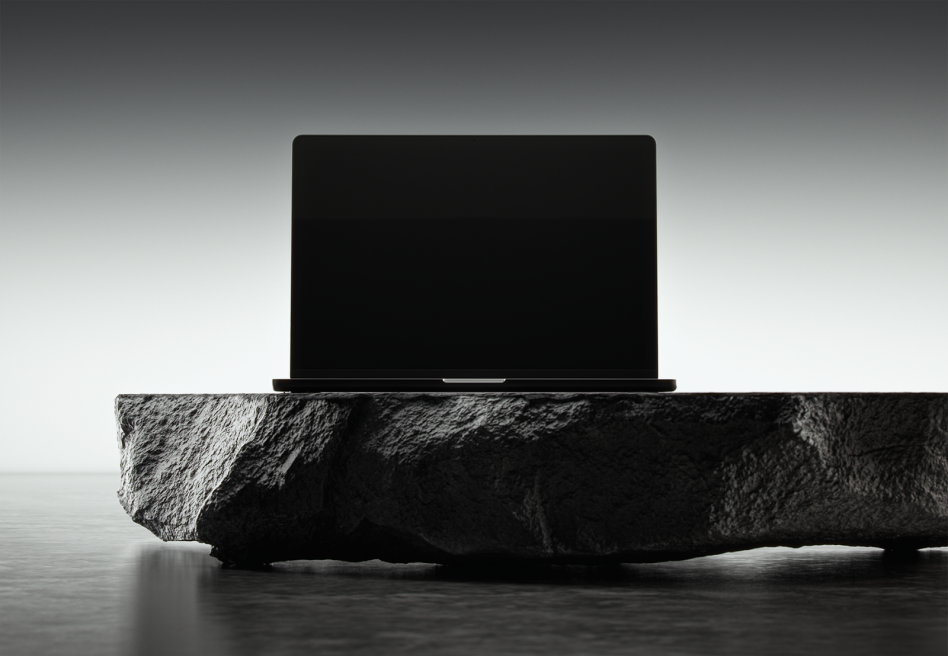 Laptop mockup on dark stone slab minimalist design sleek black screen perfect for showcasing digital art web design graphics templates SEO friendly alt text