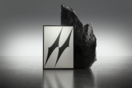 Framed abstract art print mockup with modern minimalist design against a textured rock on reflective surface. Ideal for showcasing artwork, print design.