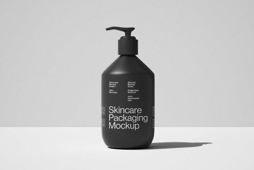 Black pump bottle skincare packaging mockup isolated on grey background ideal for designers seeking high-quality templates for skincare product presentations.