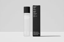 White spray bottle with black cap next to tall black box mockup