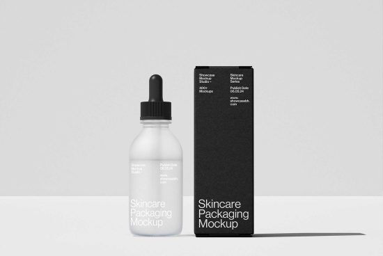 Skincare packaging mockup with frosted dropper bottle and black box. Ideal for designers creating cosmetic product designs, templates, and branding graphics.