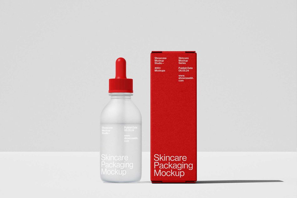 Skincare packaging mockup with dropper bottle and red box, perfect for showcasing design projects. Ideal for mockups, packaging, branding, and product design