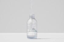 Frosted glass bottle with dropper cap suspended from above