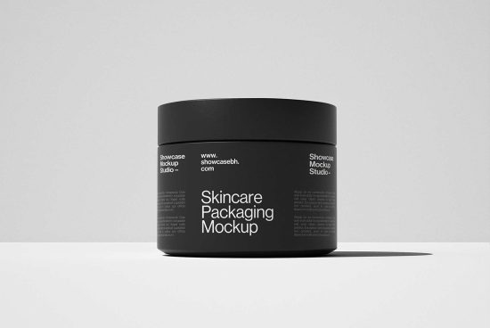 Skincare packaging mockup featuring minimalistic black jar with text by Showcase Mockup Studio in high-resolution for designers. Ideal for branding visuals.