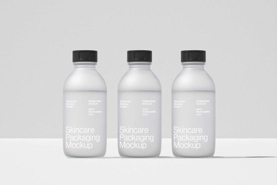 Three minimalistic skincare packaging mockup bottles shown side by side. Ideal for designers in search of clean, professional mockup templates.