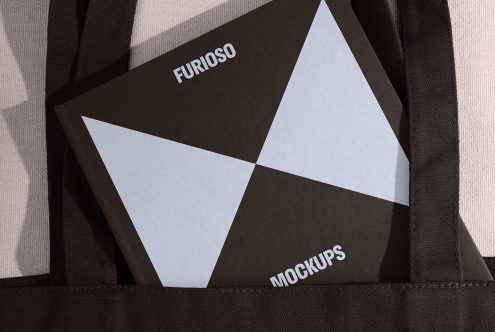 Black tote bag with a Furioso mockups book. Minimalist book cover design with geometric patterns. Perfect for designers, mockup projects, and presentation.