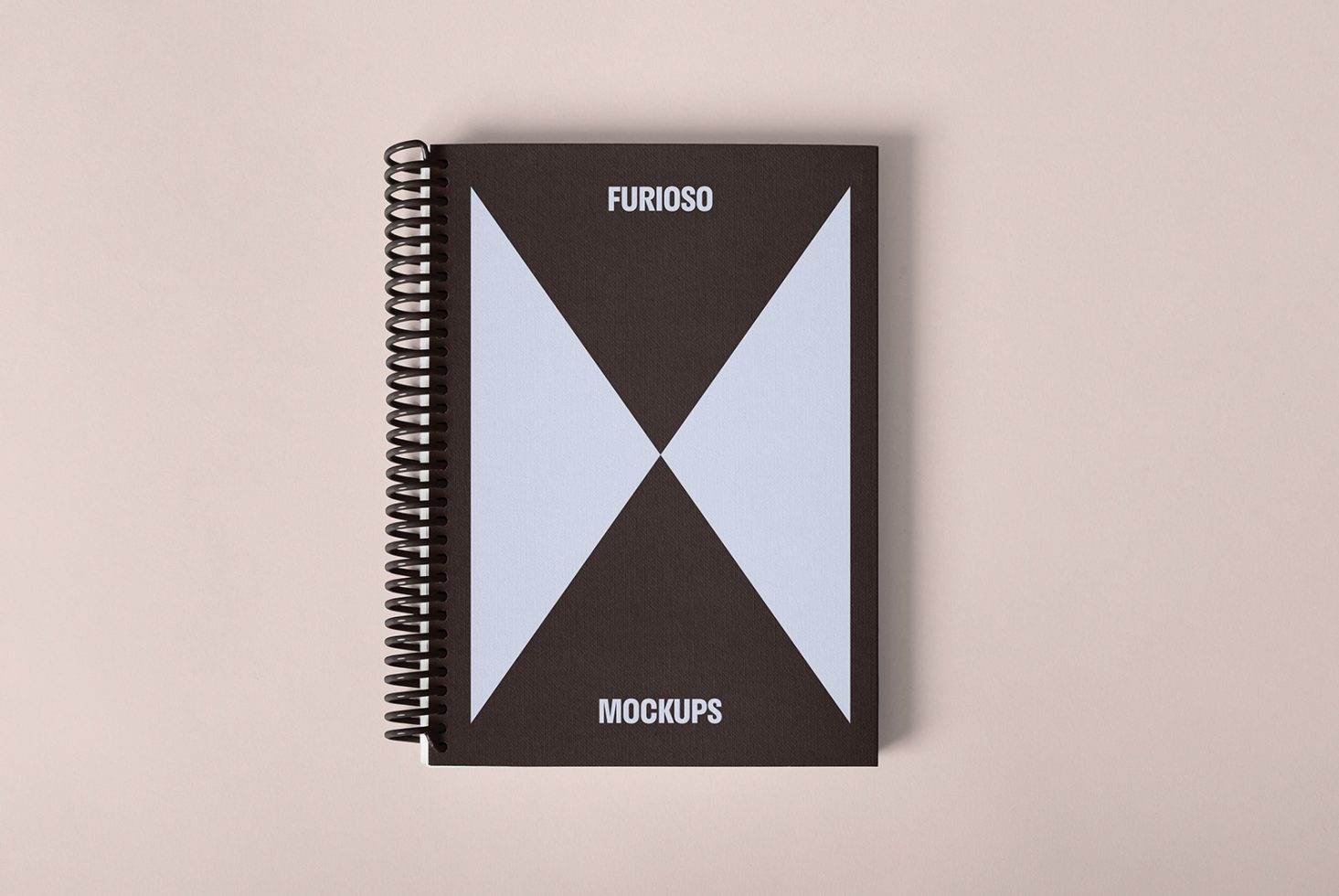 Minimalistic spiral-bound notebook mockup with geometric design for designers. Ideal for displaying graphic designs and templates. Top view on neutral background.