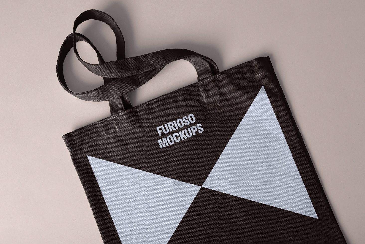 Top view of a black tote bag with blue geometric design labeled Furioso Mockups perfect for showcasing print designs mockups templates and graphic design projects