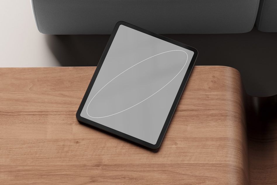 Tablet mockup on wooden table next to sofa digital device screen blank design showcase mockups templates for designers suitable for digital assets marketplace