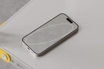 iPhone lying flat on surface with minimalist white line design on screen