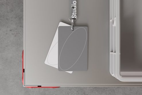 Lanyard badge mockup template for designers top view gray and white cards minimalist design on a desk perfect for event pass or ID card presentation