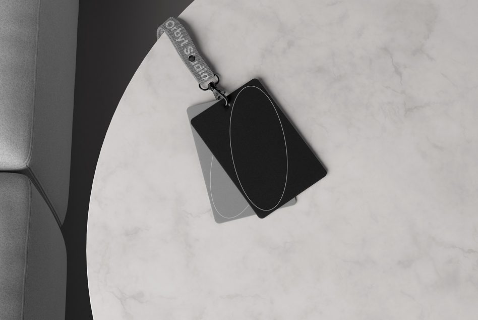 Minimalist lanyard card mockup on marble table top, featuring sleek black and gray cards. Ideal for identity branding, design showcase, and digital asset previews.