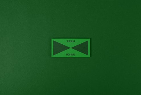 Green textured paper background with a rectangular card saying Furioso Mockups, perfect for branding mockup designs, graphic templates, and creative projects.