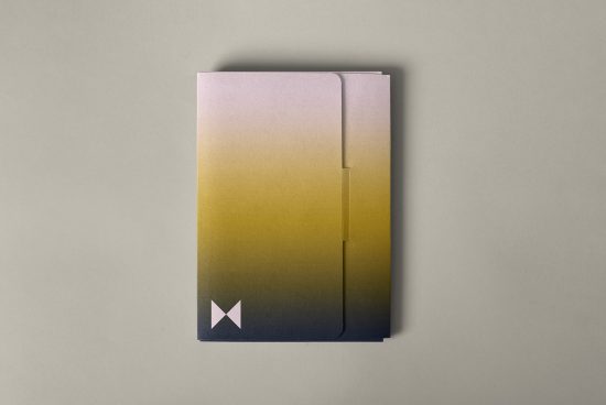 Mockup of a gradient folder for designers featuring a yellow-to-black ombre effect. Perfect for showcasing branding and stationery designs in a professional context.