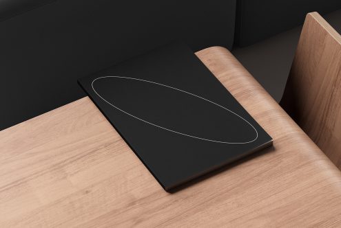 Minimalist black notebook mockup on wooden desk ideal for graphic design templates and branding presentations designers digital assets clean modern design layout