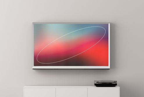 TV mockup displaying a colorful abstract screensaver with white ellipse, placed above a white cabinet with a black turntable. Ideal for design templates.