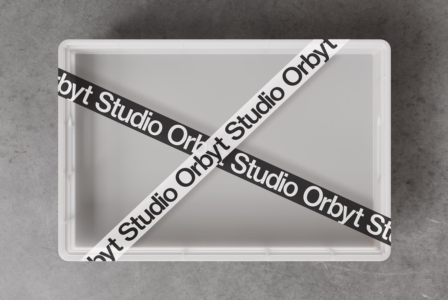 Empty white box with black and white Orbyt Studio tape in X shape, modern product photography, sleek minimalist design, suitable for graphic design mockups.