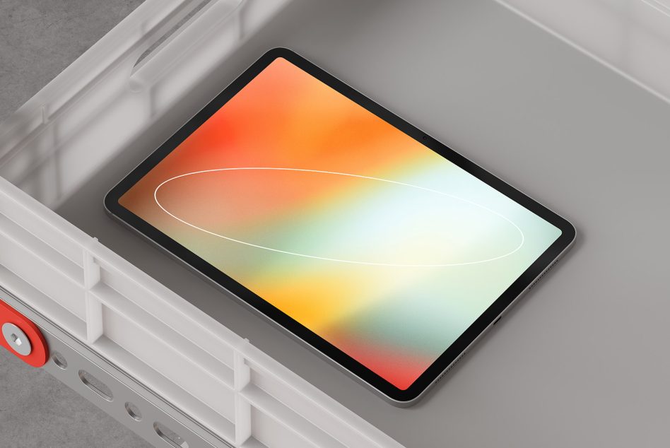 Tablet mockup with vibrant orange to yellow gradient on screen in storage bin