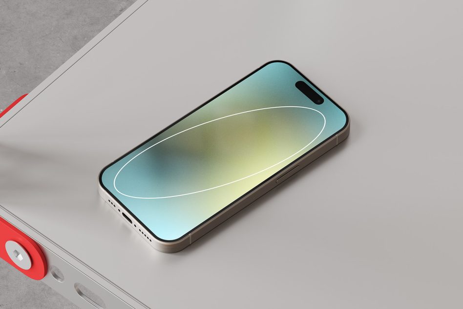 Smartphone mockup on a minimalistic table, showcasing the device screen with a colorful gradient background ideal for app designers and UI/UX presentations