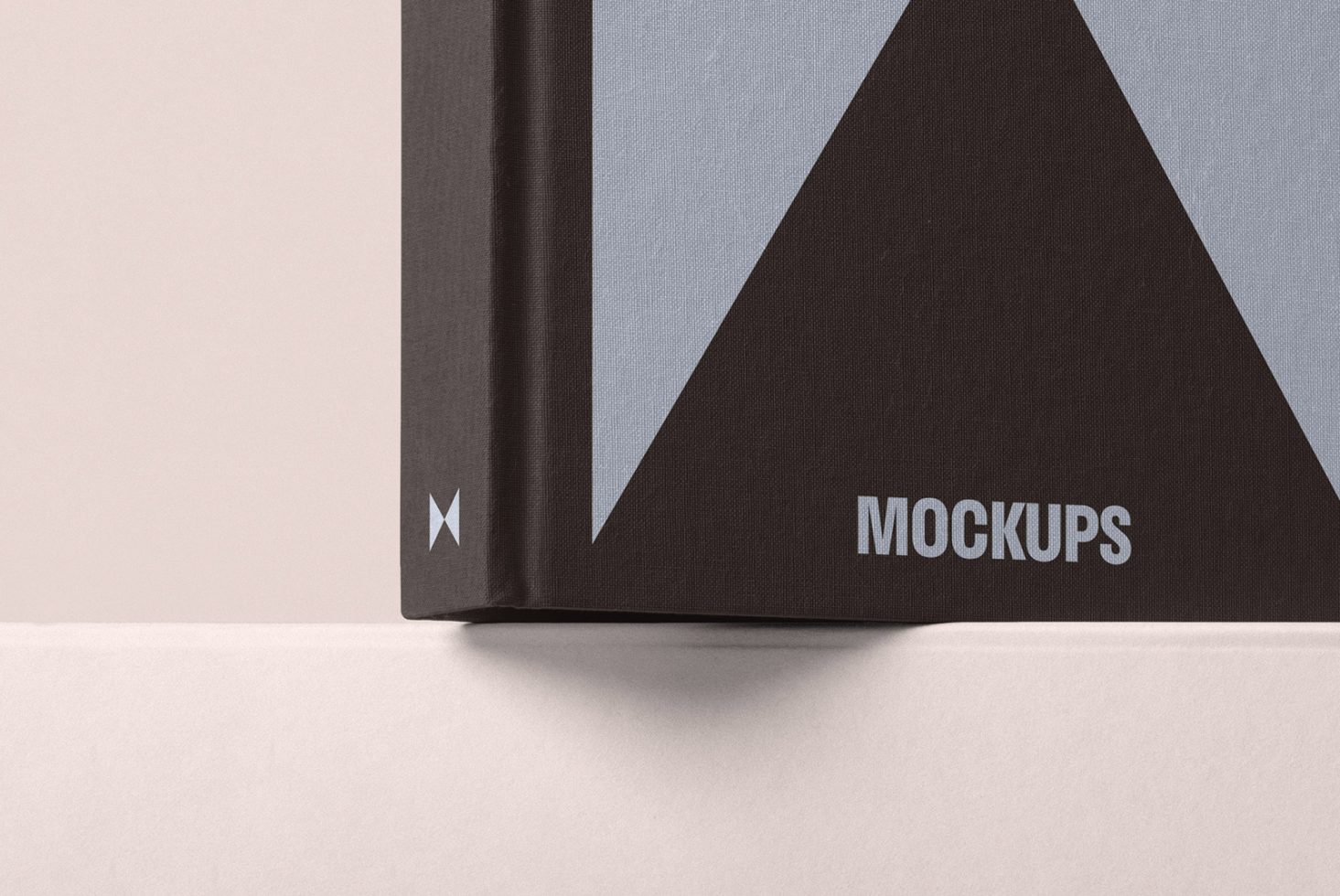 Close-up of hardcover book mockup with black and gray geometric design suitable for graphic designers and digital asset creation. Keywords: book mockup design.