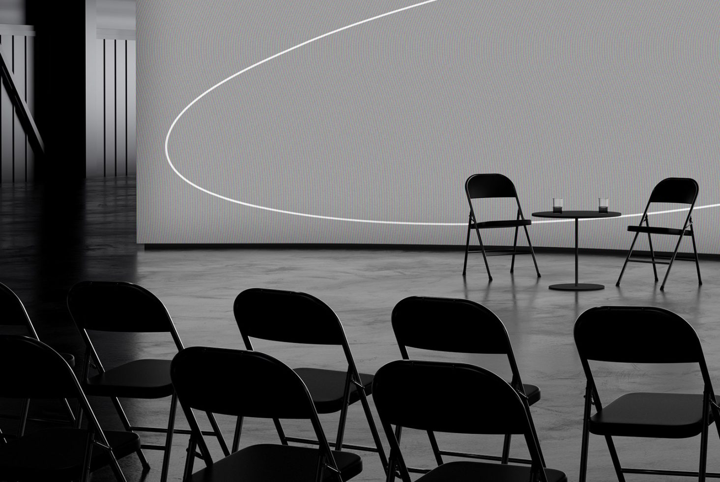 A clean, modern conference room setup with black folding chairs, round table, and backdrop for presentations perfect for mockups, templates, and design assets.