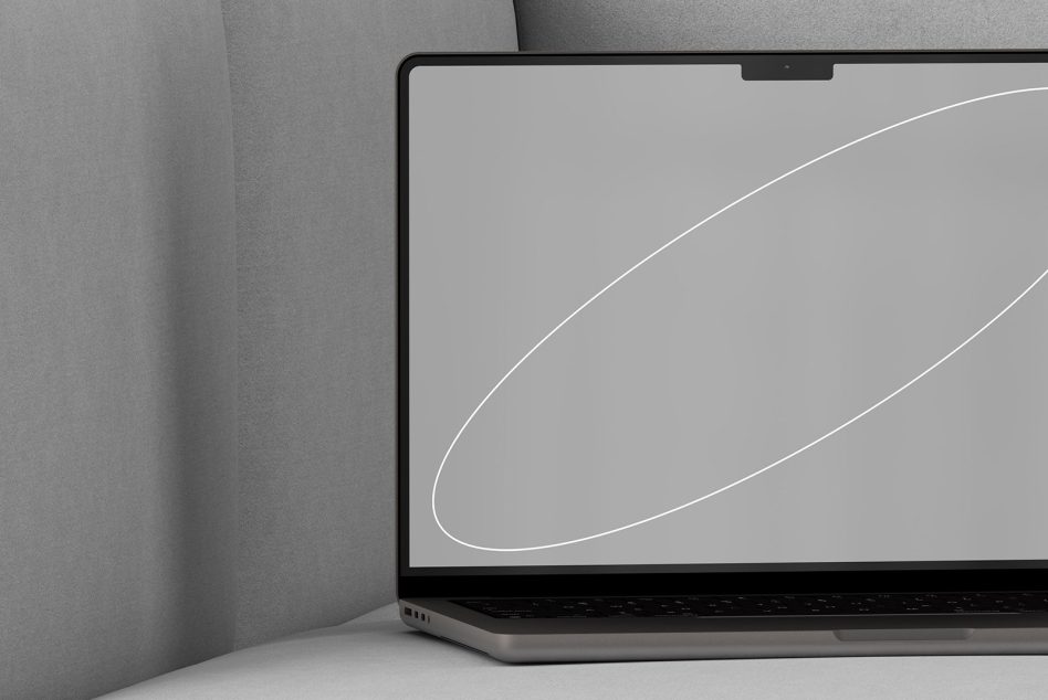 Mockup of a laptop with blank screen on a grey sofa ideal for presenting website designs digital assets templates realistic environment designers professional tools