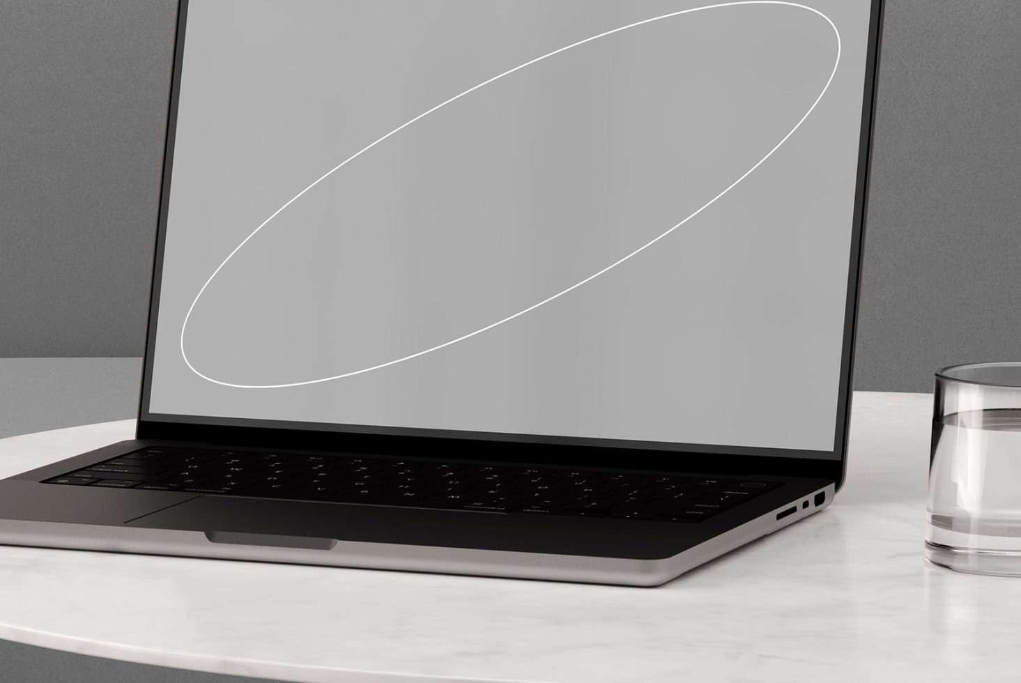 Laptop mockup with blank screen on marble table, next to glass of water. Perfect for web design templates, app showcasing, and digital product presentations.