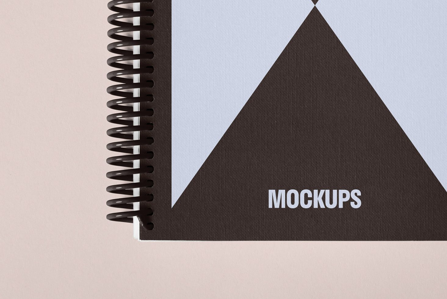 Spiral notebook cover mockup for designers showcasing minimalist design with geometric shapes labeled mockups ideal for graphic and template presentations