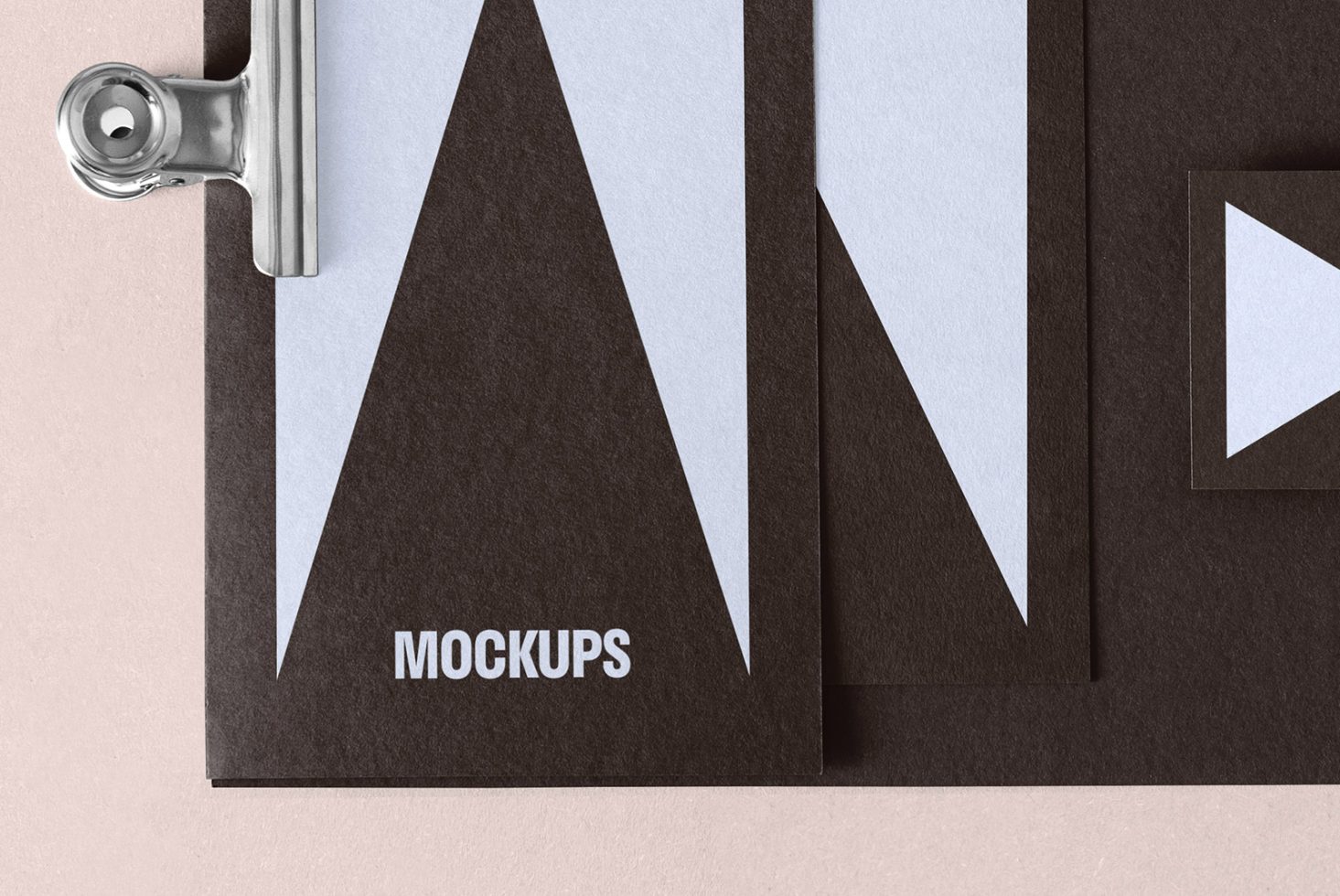 A mockup of black and white geometric stationery design with a clipboard. Perfect for showcasing branding mockups, templates, and design assets for designers.