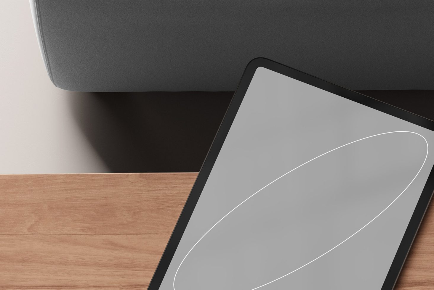 Modern digital tablet mockup on wooden desk with a grey backdrop ideal for designers creating sleek templates graphics and digital asset presentations