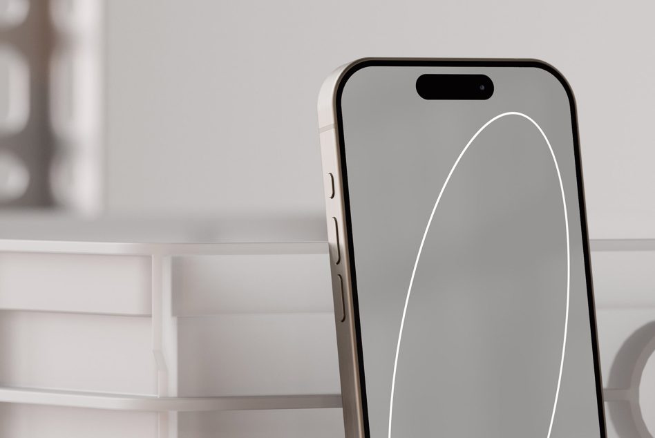 Smartphone mockup with a white case placed on a modern desk background perfect for product presentation templates user-interface design and graphics.