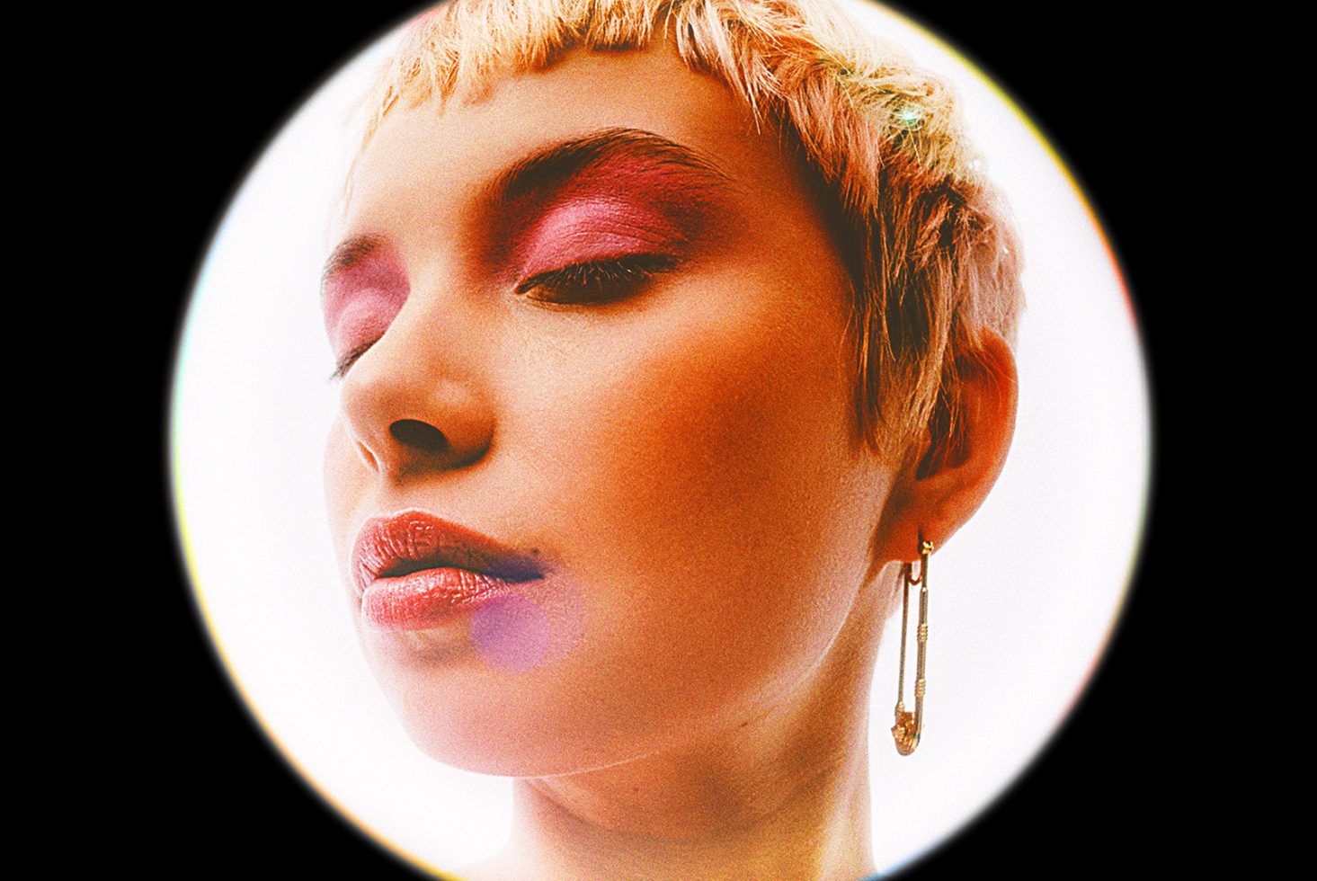 Close-up portrait of a person with colorful makeup and an earring design graphic for digital designers creative visuals high-quality image asset for Templates.