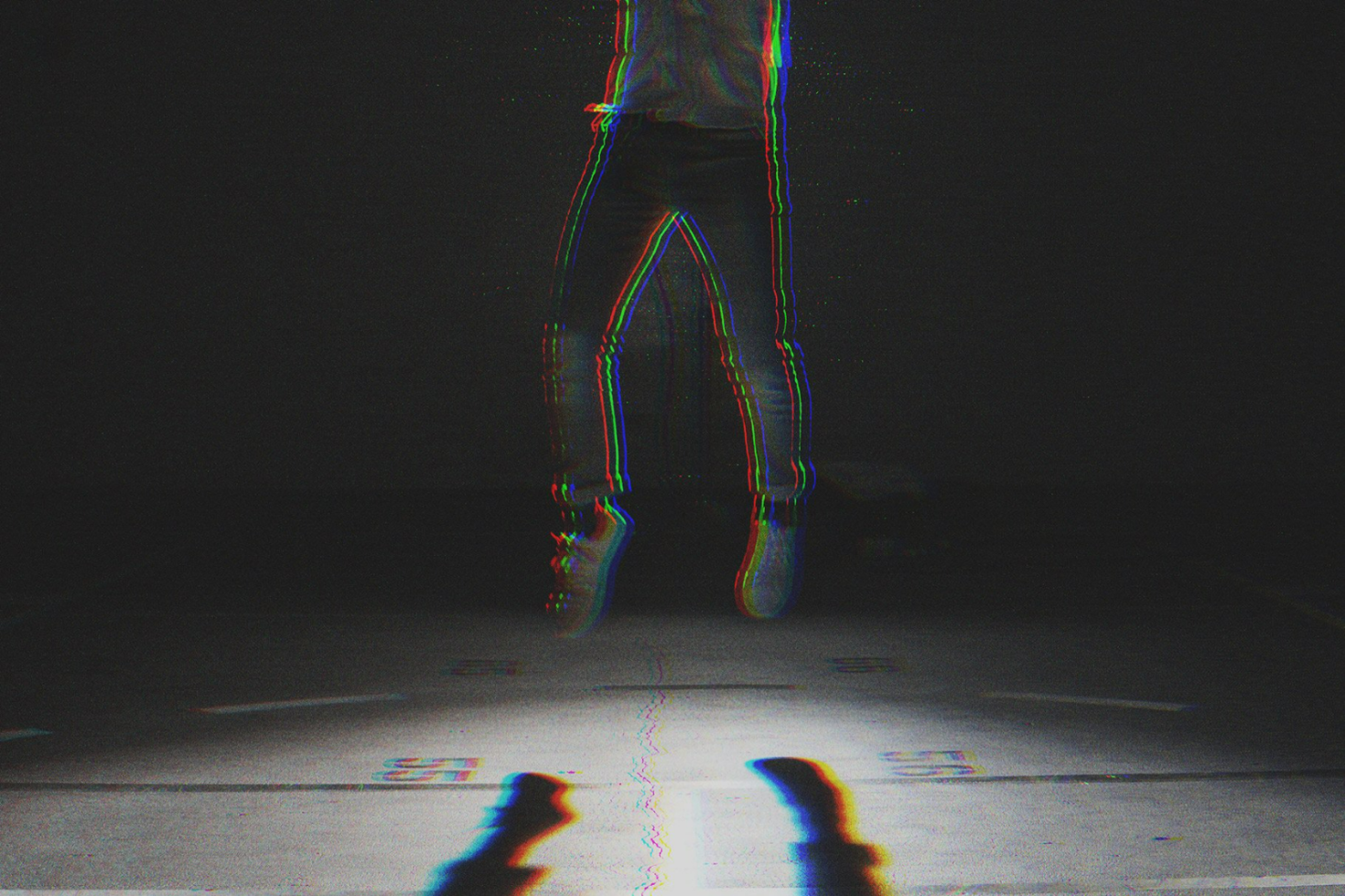 Glitch effect graphic showcasing a person suspended mid-air against a dark background ideal for designers creating edgy and modern digital assets and mockups