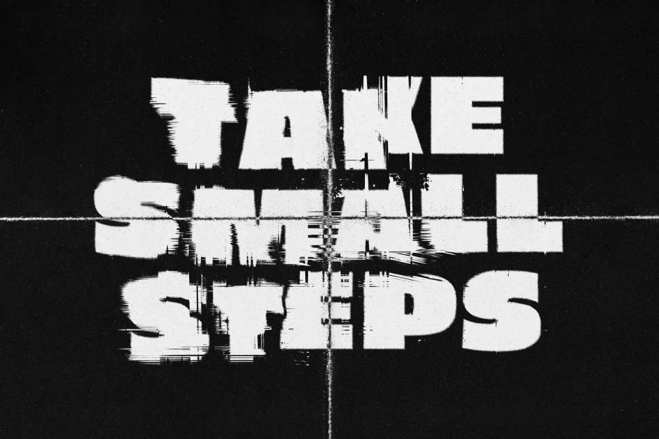 Grunge-style font graphic with a white text Take Small Steps on a black background suitable for posters quotes design resources. Keywords grunge font graphic.