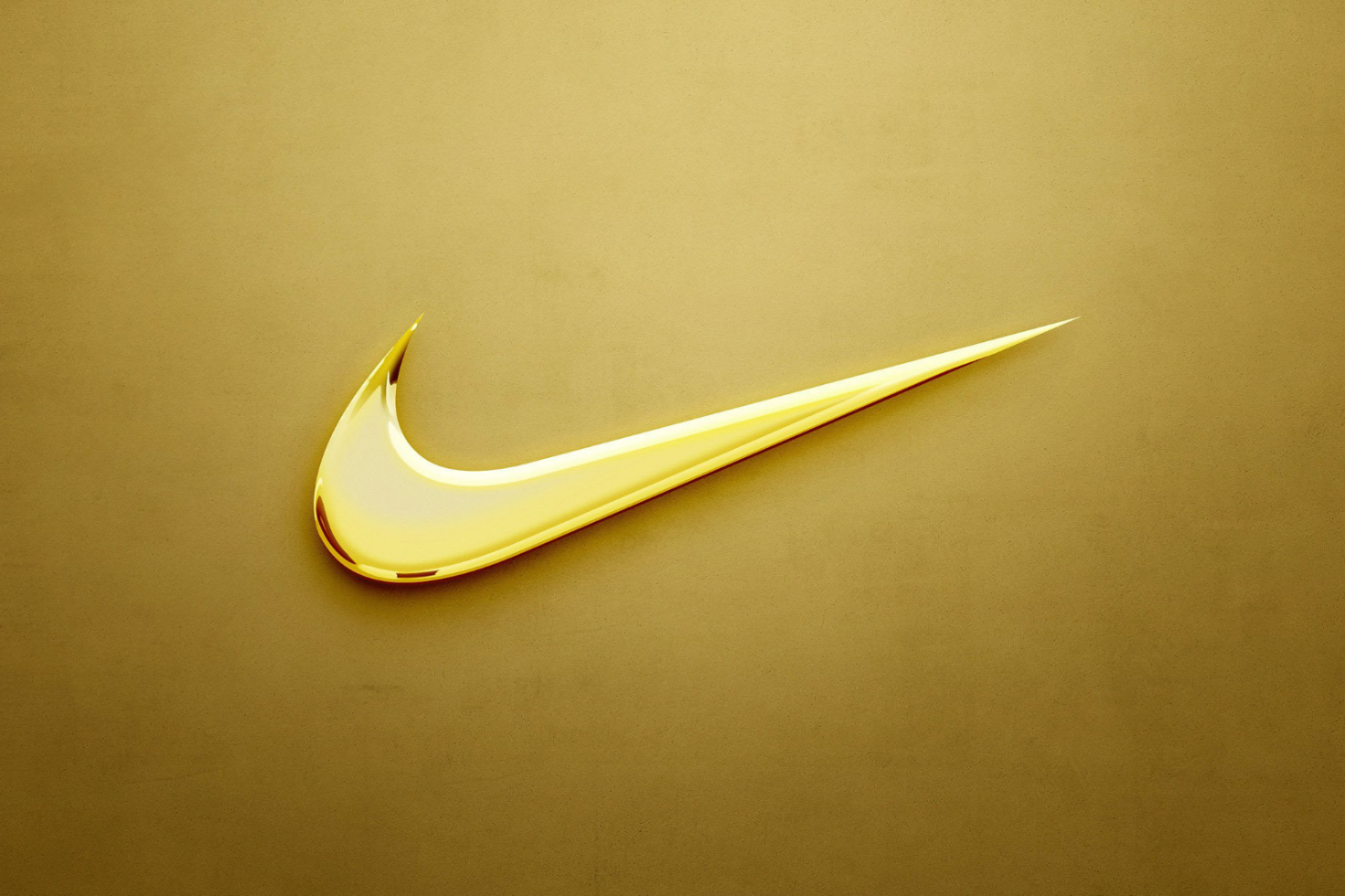 Golden glossy swoosh logo on textured gold background perfect for branding templates graphic design mockups digital assets for designers and marketers