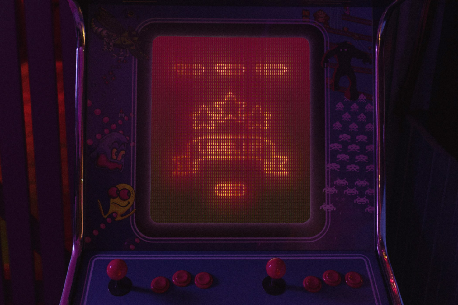 Retro arcade machine glowing screen with pixel art crown and joystick. Perfect for designers looking for vintage gaming elements in graphics and mockups