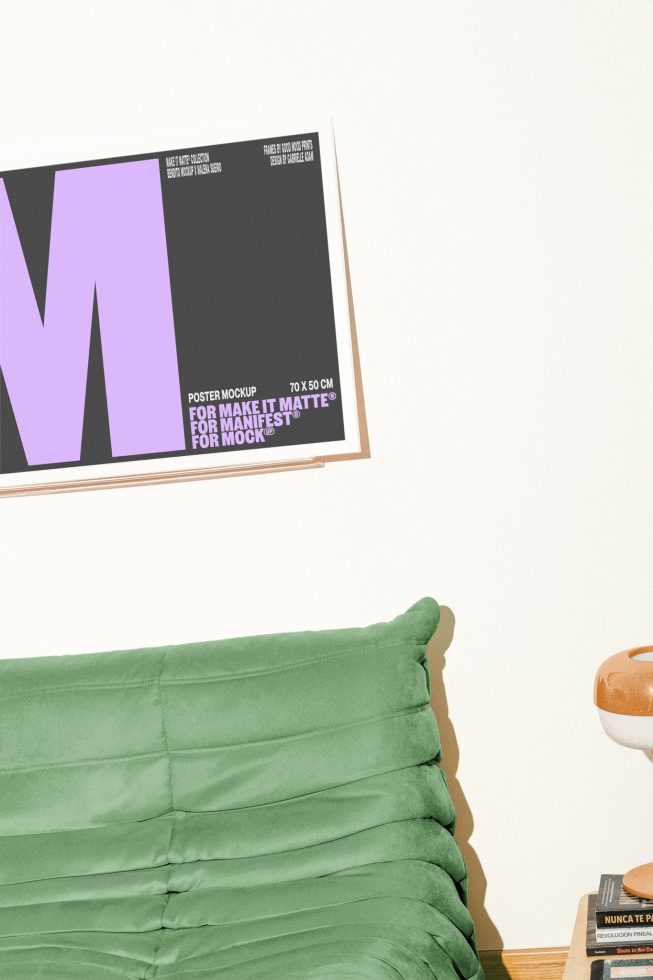 Poster mockup for designers showing a framed poster with large purple letter M above a green sofa next to a side table with books for mockups templates graphics