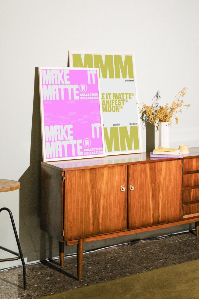 Poster mockups on wooden cabinet with books and flowers for design showcase. Ideal for designers seeking high-quality graphics templates and mockups.