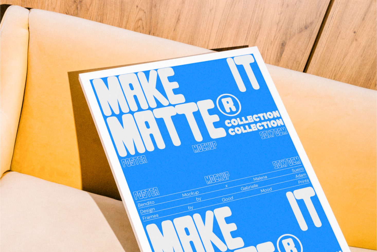 Poster mockup featuring bold typography on a bright blue background, displayed on a cozy beige couch backdrop, ideal for graphic design templates.