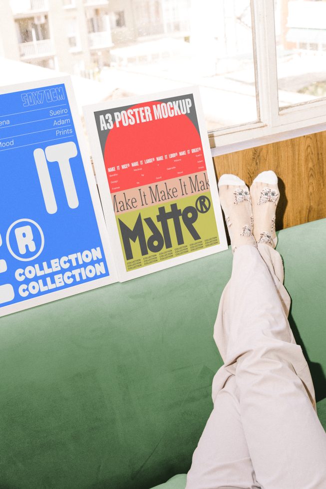 Casual scene of a designer's workspace featuring colorful A3 poster mockups with one person relaxing on a green couch. Perfect for Mockups category.