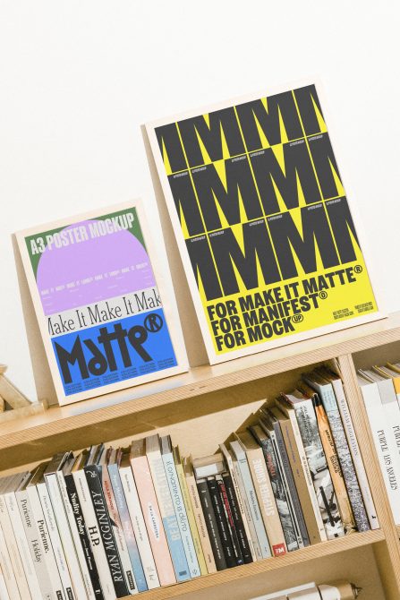 A3 Poster Mockup Designs displayed on a wooden shelf with books in the background perfect for graphic designers looking for realistic mockup templates and graphics