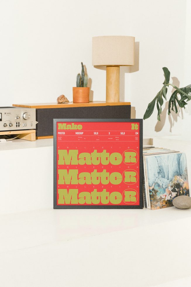 Poster mockup in a home setting showcasing vibrant typography design on a shelf with a lamp, stereo, cactus plant, and vinyl records, ideal for designers.