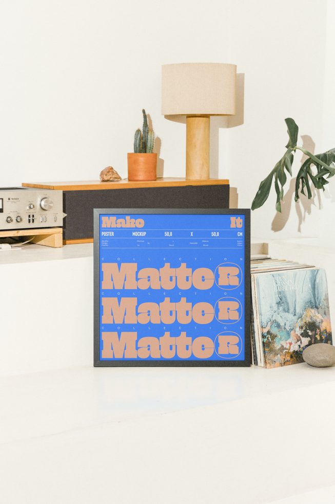 Poster mockup for designers showcasing a blue and brown text design with retro-styled elements. Lamp, plant in terracotta pot, and vinyl records in background.