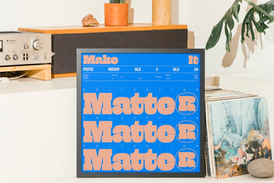 Retro poster mockup with bold orange type on bright blue, displayed in styled desk setup with vintage gear