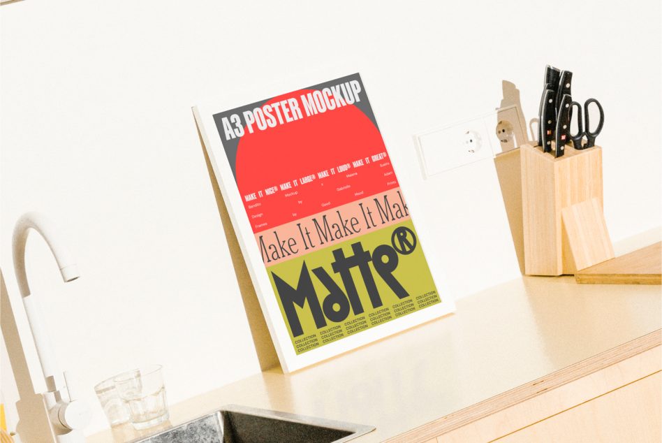 Bright A3 poster mockup with red, yellow, black color blocks on white kitchen counter