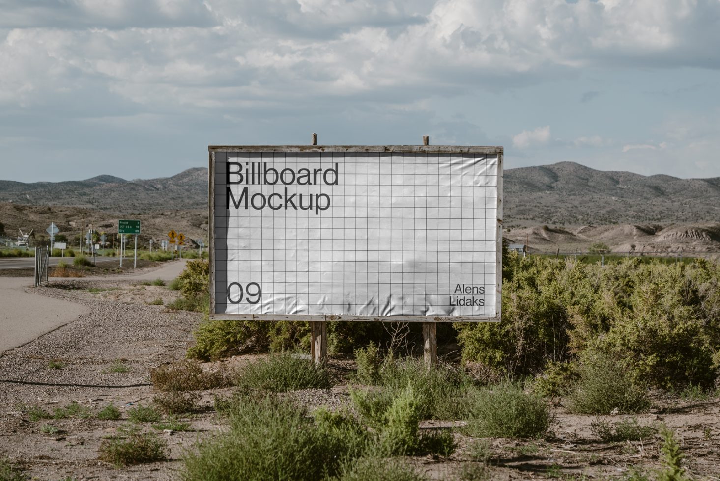 Outdoor billboard mockup with grid lines for advertising design presentation. Ideal for graphic designers showcasing large-scale print templates in a rural setting.