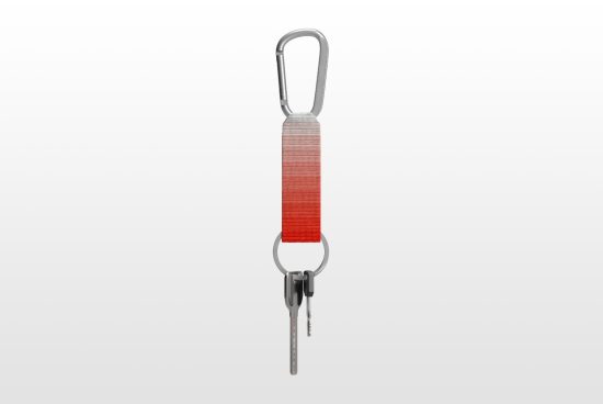 Keychain mockup with a gradient red strap and metal carabiner on a white background perfect for designers digital assets templates and mockup collections