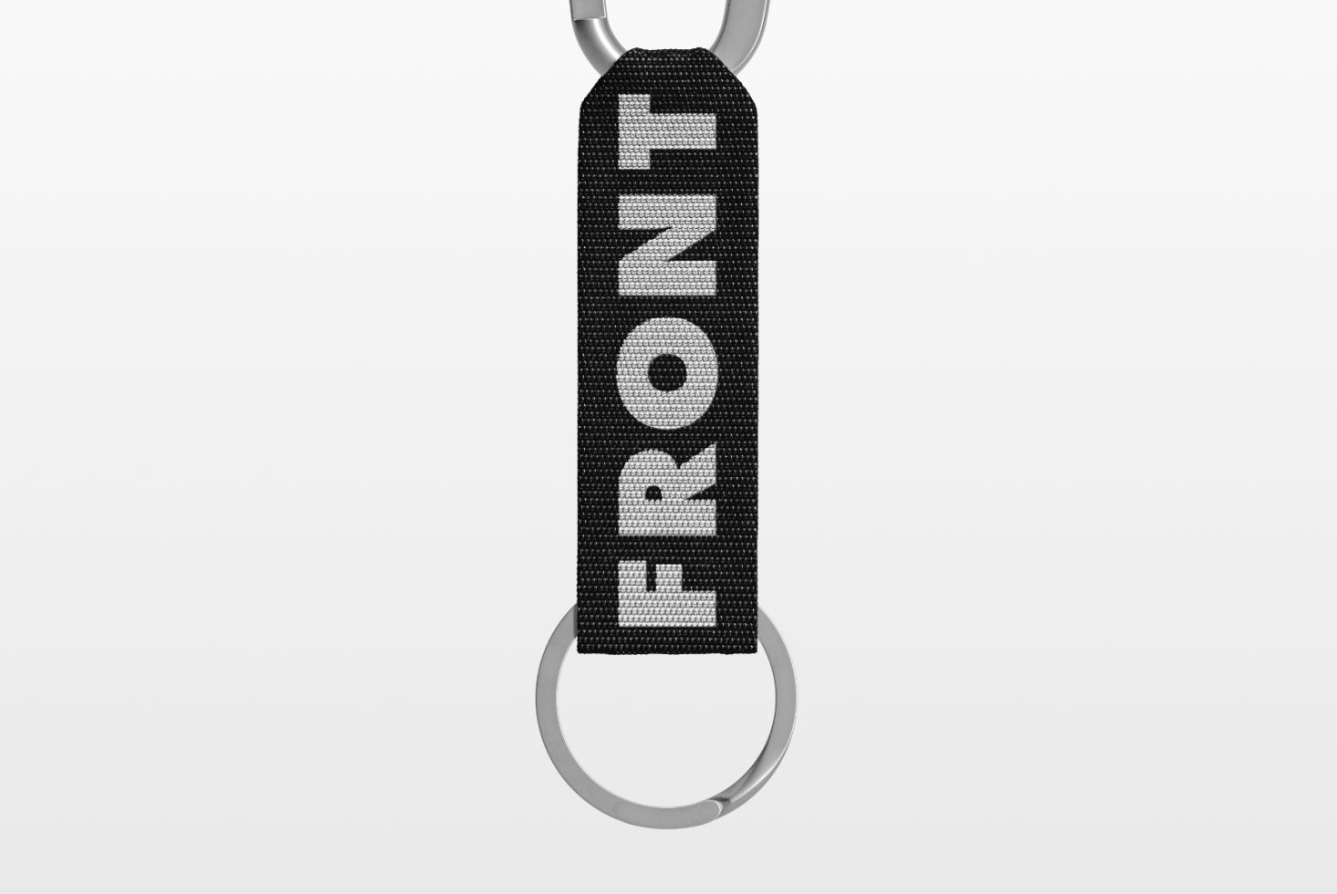 Black fabric keychain mockup with the word FRONT printed in white bold text, isolated on a white background. Ideal for designers, perfect for branding and templates.