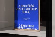 Wooden framed DIN A poster mockup with bright blue background displayed on white shelf